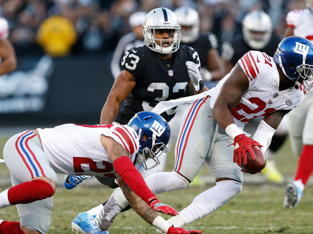 OAKLAND, CA - DECEMBER 03: Landon Collins #21 of the New York Giants recovers a fumble by Johnny Holton #16 of the Oakland Raiders during their NFL game at Oakland-Alameda County Coliseum on December 3, 2017 in Oakland, California.