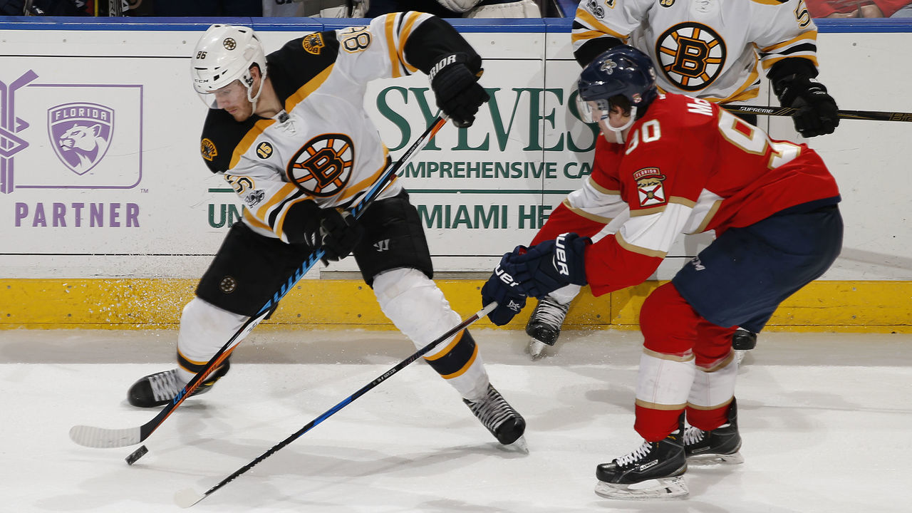 SUNRISE, FL - JANUARY 7: Jared McCann #90 of the Florida Panthers battles with Kevan Miller #86 of the Boston Bruins for control of the puck at the BB&T Center on January 7, 2017 in Sunrise, Florida. The Bruins defeated the Panthers 4-0.
