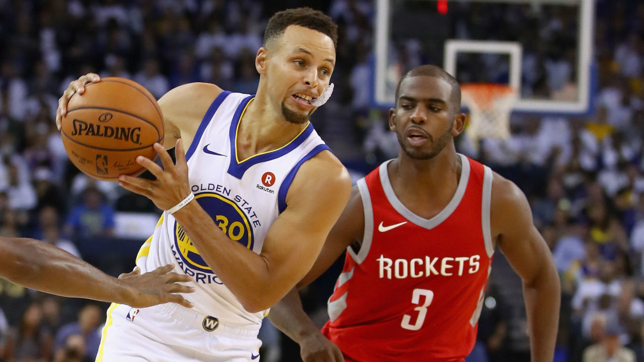 OAKLAND, CA - OCTOBER 17: Stephen Curry #30 of the Golden State Warriors drives on Chris Paul #3 of the Houston Rockets at ORACLE Arena on October 17, 2017 in Oakland, California.
