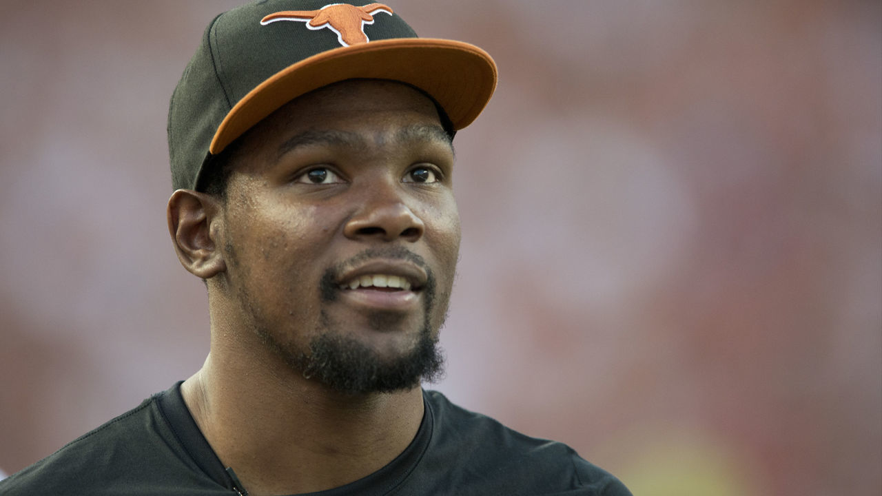 AUSTIN, TX - SEPTEMBER 14: Kevin Durant of the Oklahoma City Thunder enjoys the game from the sidelines as the Texas Longhorns host the Mississippi Rebels on September 14, 2013 at Darrell K Royal-Texas Memorial Stadium in Austin, Texas.