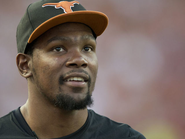 AUSTIN, TX - SEPTEMBER 14: Kevin Durant of the Oklahoma City Thunder enjoys the game from the sidelines as the Texas Longhorns host the Mississippi Rebels on September 14, 2013 at Darrell K Royal-Texas Memorial Stadium in Austin, Texas.