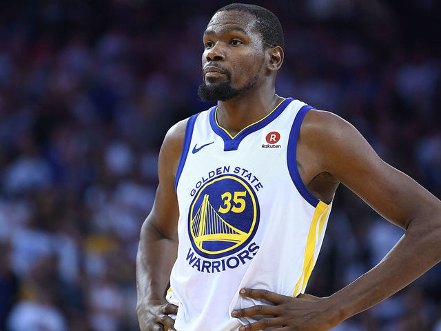 OAKLAND, CA - DECEMBER 25: Kevin Durant #35 of the Golden State Warriors looks on while there's a break in the action against the Cleveland Cavaliers late in the fouth quarter of an NBA basketball game at ORACLE Arena on December 25, 2017 in Oakland, California.