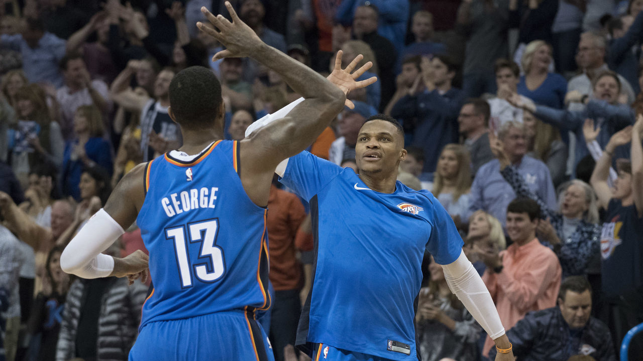 OKLAHOMA CITY, OK - NOVEMBER 22: Paul George #13 of the Oklahoma City Thunder and Russell Westbrook #0 of the Oklahoma City Thunder celebrate during the second half of a NBA game against the Golden State Warriors at the Chesapeake Energy Arena on November 22, 2017 in Oklahoma City, Oklahoma.