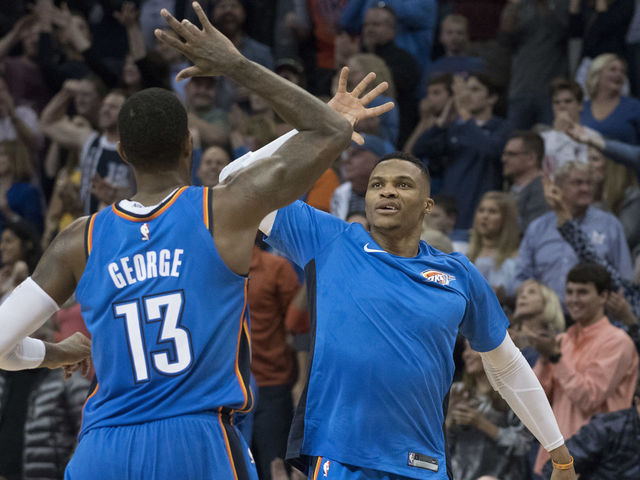 OKLAHOMA CITY, OK - NOVEMBER 22: Paul George #13 of the Oklahoma City Thunder and Russell Westbrook #0 of the Oklahoma City Thunder celebrate during the second half of a NBA game against the Golden State Warriors at the Chesapeake Energy Arena on November 22, 2017 in Oklahoma City, Oklahoma.