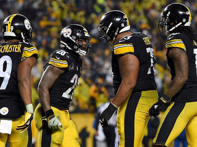 PITTSBURGH, PA - DECEMBER 17: Le'Veon Bell #26 of the Pittsburgh Steelers celebrates with teammates after rushing for a 4 yard touchdown in the third quarter during the game against the New England Patriots at Heinz Field on December 17, 2017 in Pittsburgh, Pennsylvania.