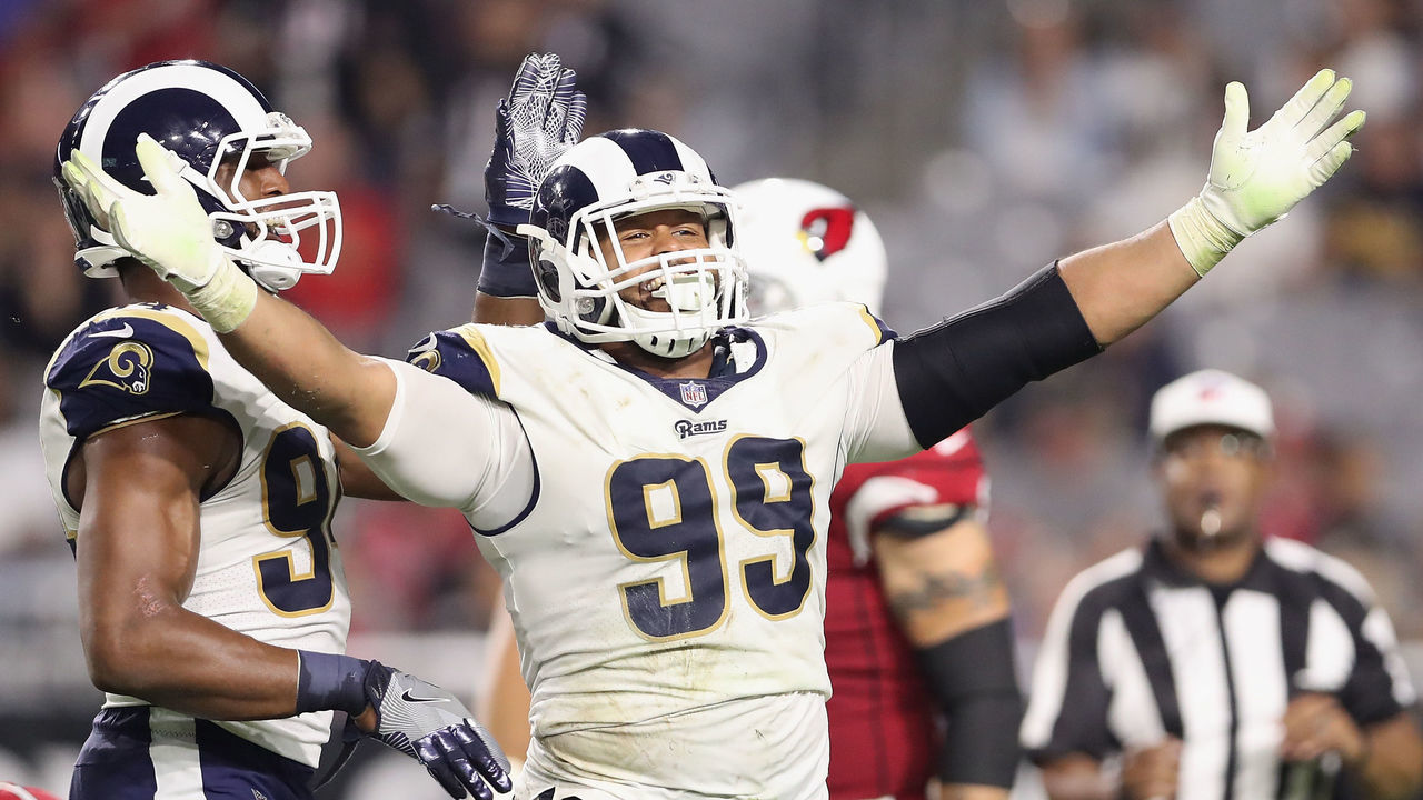 GLENDALE, AZ - DECEMBER 03: Defensive end Aaron Donald #99 of the Los Angeles Rams reacts after a tackle on quarterback Blaine Gabbert #7 of the Arizona Cardinals during the second half of the NFL game at the University of Phoenix Stadium on December 3, 2017 in Glendale, Arizona. The Rams defeated the Cardinals 32-16.