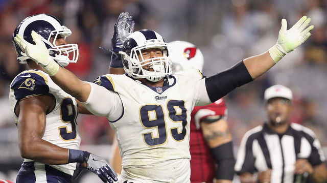 GLENDALE, AZ - DECEMBER 03: Defensive end Aaron Donald #99 of the Los Angeles Rams reacts after a tackle on quarterback Blaine Gabbert #7 of the Arizona Cardinals during the second half of the NFL game at the University of Phoenix Stadium on December 3, 2017 in Glendale, Arizona. The Rams defeated the Cardinals 32-16.