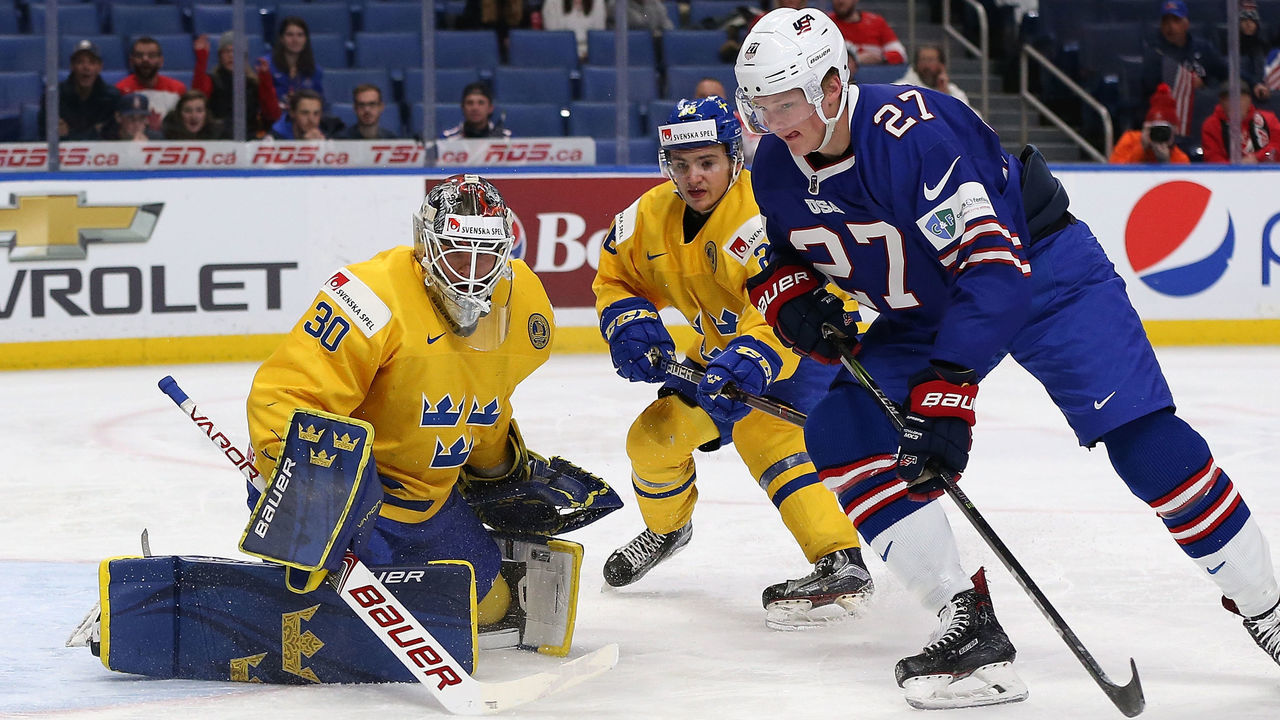 BUFFALO, NY - JANUARY 4: Filip Gustavsson #30 of Sweden makes the save against Riley Tufte #27 of United States in the second period during the IIHF World Junior Championship at KeyBank Center on January 4, 2018 in Buffalo, New York.