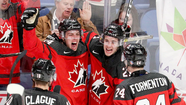 BUFFALO, NY - JANUARY 04: Maxime Comtois #14 of Canada celebrates with Kale Clague #10, Alex Formenton #24, and Brett Howden #21 after Comtois' goal gave team Cananda a 4-1 lead during the second period of play in the IIHF World Junior Championships Semifinal game at KeyBank Center on January 4, 2018 in Buffalo, New York.