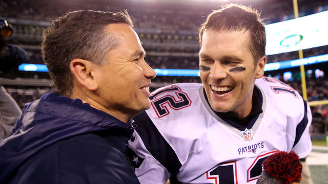EAST RUTHERFORD, NJ - NOVEMBER 27: Tom Brady #12 of the New England Patriots celebrates with trainer Alex Guerrero after defeating the New York Jets with a score of 22 to 17 at MetLife Stadium on November 27, 2016 in East Rutherford, New Jersey.