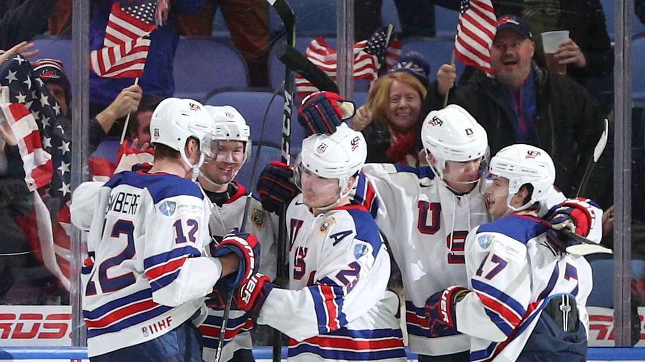 BUFFALO, NY - JANUARY 02: Kieffer Bellows #23 of United States celebrates his second goal of the game against team Russia with his teammates Dylan Samberg #12, Phil Kemp #25, Ryan Poehling #4 and Kailer Yamamoto #17 during the third period of play in the Quarterfinal IIHF World Junior Championship game at the KeyBank Center on January 2, 2018 in Buffalo, New York.