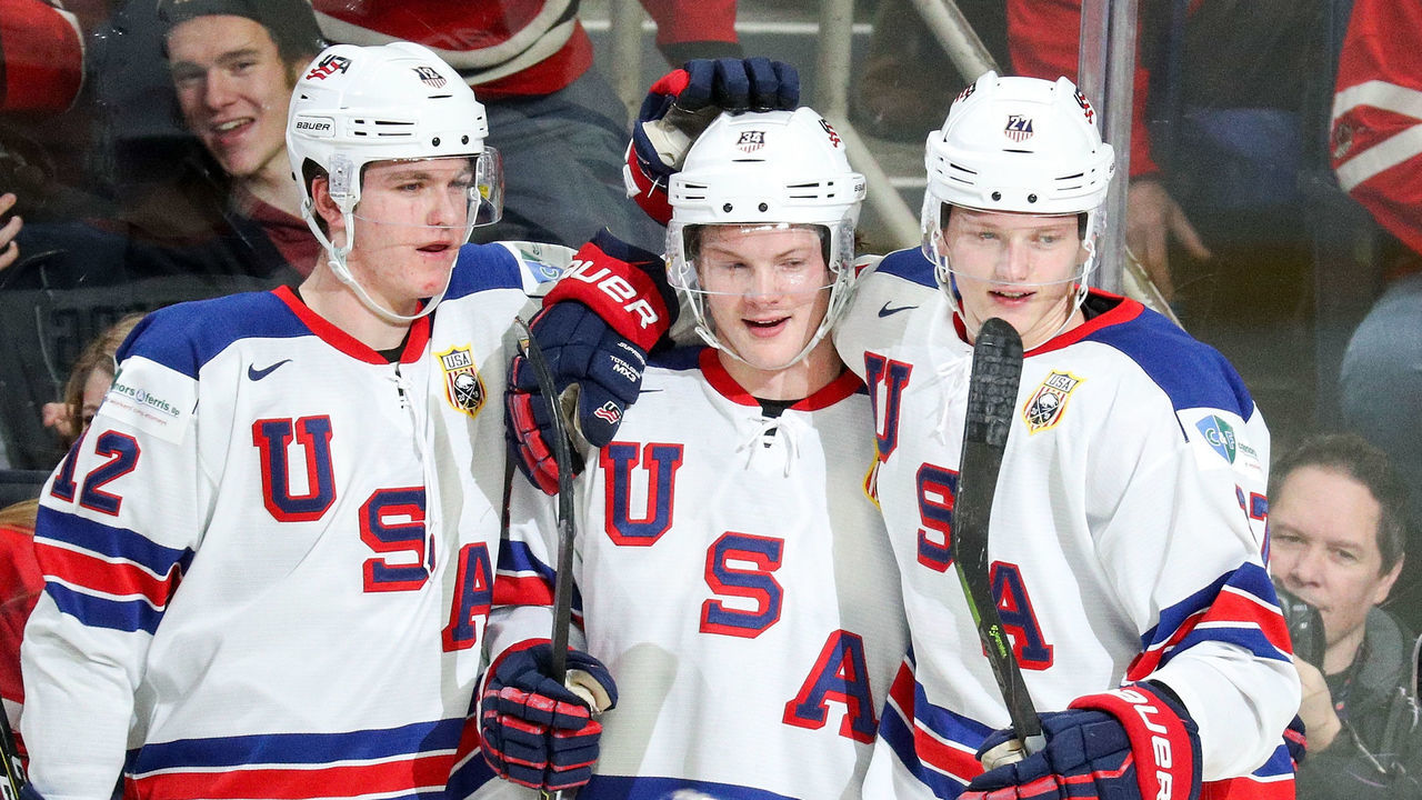 BUFFALO, NY - JANUARY 05: Trent Frederic #34 of United States (center) celebrates his hat trick goal with Dylan Samberg #12 and Riley Tufte #27 during the second period of play against the Czech Republic in the IIHF World Junior Championships Bronze Medal game at KeyBank Center on January 5, 2018 in Buffalo, New York. Team USA held a 7-0 after the second period.