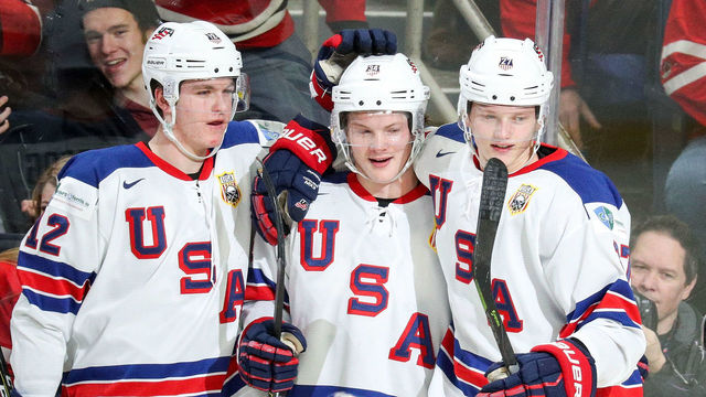 BUFFALO, NY - JANUARY 05: Trent Frederic #34 of United States (center) celebrates his hat trick goal with Dylan Samberg #12 and Riley Tufte #27 during the second period of play against the Czech Republic in the IIHF World Junior Championships Bronze Medal game at KeyBank Center on January 5, 2018 in Buffalo, New York. Team USA held a 7-0 after the second period.