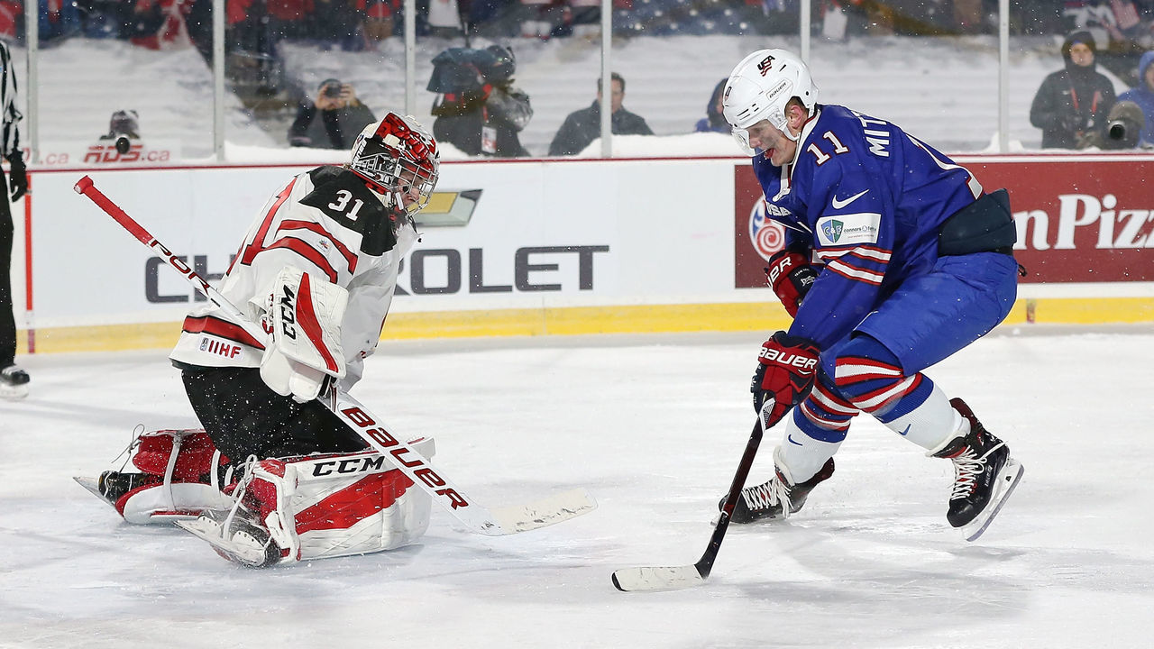BUFFALO, NY - DECEMBER 29: Carter Hart #31 of Canada makes the save against Casey Mittelstadt #11 of United States during the IIHF World Junior Championship at New Era Field on December 29, 2017 in Buffalo, New York. The United States beat Canada 4-3.