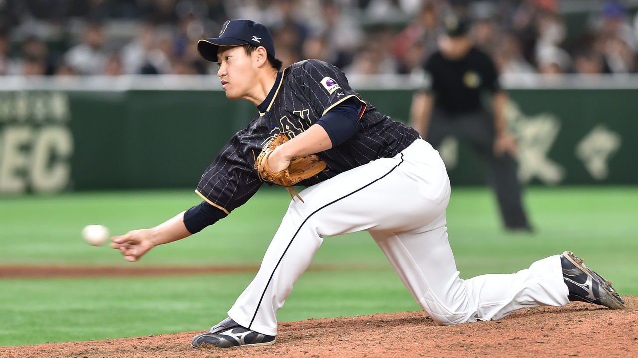 Japan's closing pitcher Kazuhisa Makita throws a pitch in the bottom of the ninth inning during the World Baseball Classic Pool B first round match between Japan and Australia at Tokyo Dome in Tokyo on March 8, 2017. / AFP PHOTO / KAZUHIRO NOGI