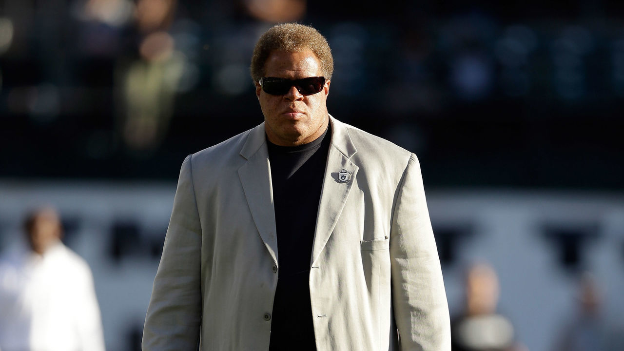 OAKLAND, CA - AUGUST 15: Oakland Raiders general manager Reggie McKenzie stands on the field before their preseason game against the Detroit Lions at O.co Coliseum on August 15, 2014 in Oakland, California.