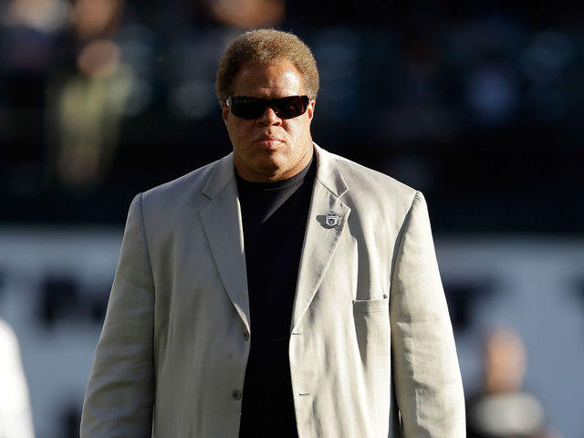 OAKLAND, CA - AUGUST 15: Oakland Raiders general manager Reggie McKenzie stands on the field before their preseason game against the Detroit Lions at O.co Coliseum on August 15, 2014 in Oakland, California.
