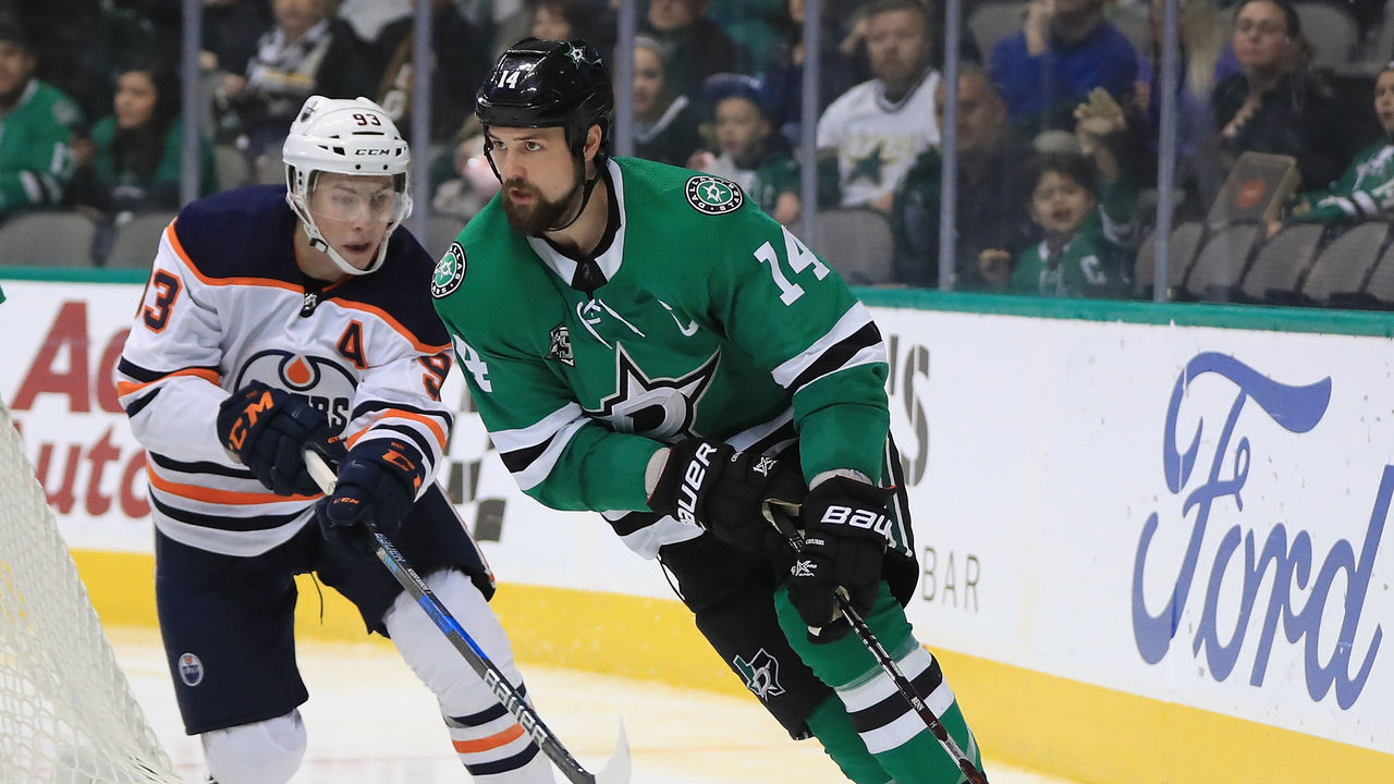 DALLAS, TX - JANUARY 06: Jamie Benn #14 of the Dallas Stars skates the puck against the Edmonton Oilers in the second period at American Airlines Center on January 6, 2018 in Dallas, Texas.