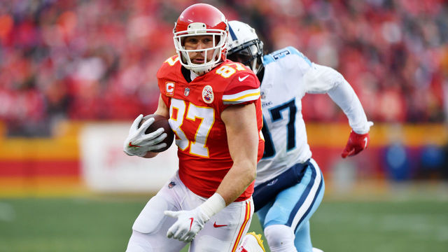 KANSAS CITY, MO - JANUARY 6: Tight end Travis Kelce #87 of the Kansas City Chiefs runs after the catch during the first quarter of the game against the Tennessee Titans at Arrowhead Stadium on January 6, 2018 in Kansas City, Missouri.