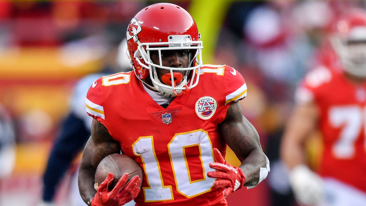 KANSAS CITY, MO - JANUARY 6: Wide receiver Tyreek Hill #10 of the Kansas City Chiefs runs after the catch for a long gain during the first quarter of the AFC Wild Card Playoff game against the Tennessee Titans at Arrowhead Stadium on January 6, 2018 in Kansas City, Missouri.