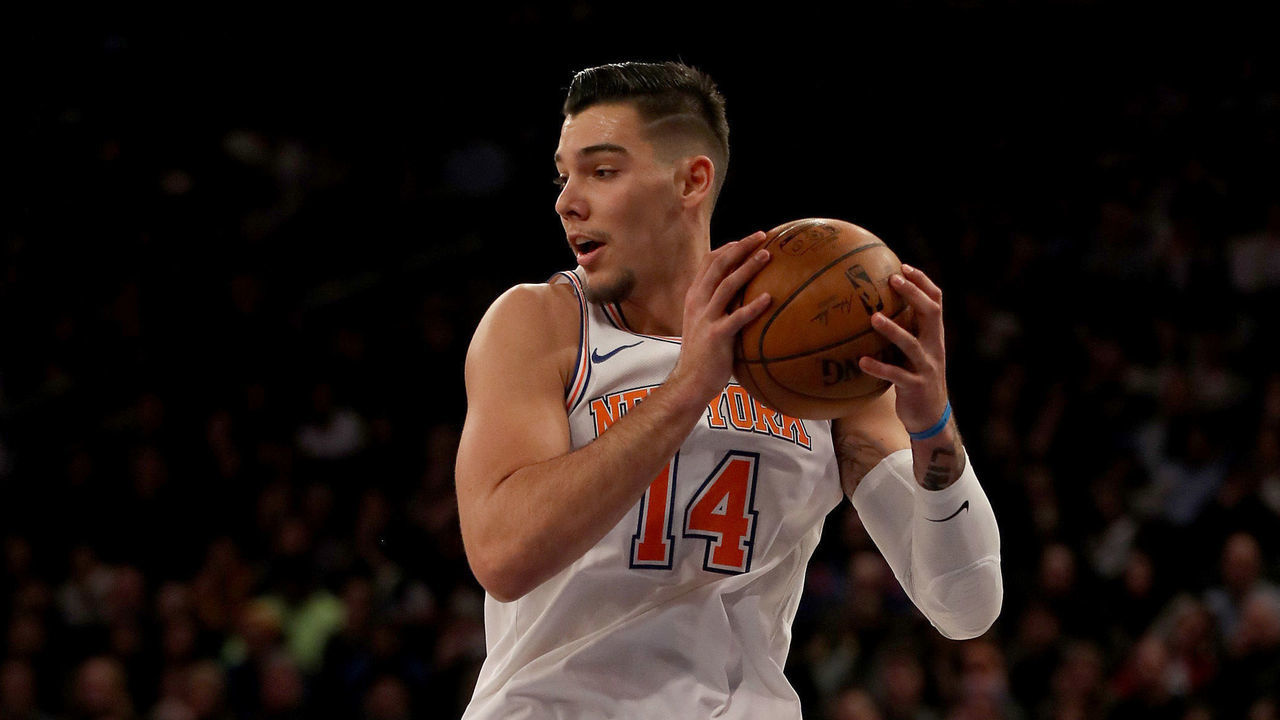 NEW YORK, NEW YORK - JANUARY 02: Willy Hernangomez #14 of the New York Knicks grabs the rebound in the second half against the San Antonio Spurs at Madison Square Garden on January 02, 2018 in New York City.