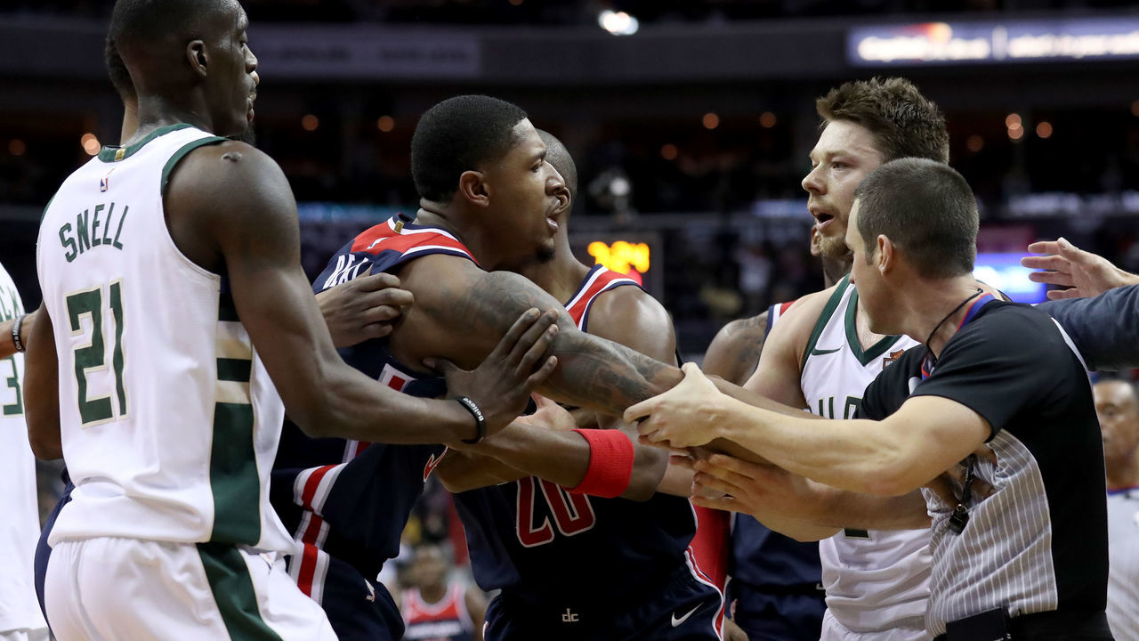WASHINGTON, DC - JANUARY 6: Bradley Beal #3 of the Washington Wizards and Matthew Dellavedova #8 of the Milwaukee Bucks are separated after Dellavedova fouled Beal and ejected in the second half at Capital One Arena on January 6, 2018 in Washington, DC.