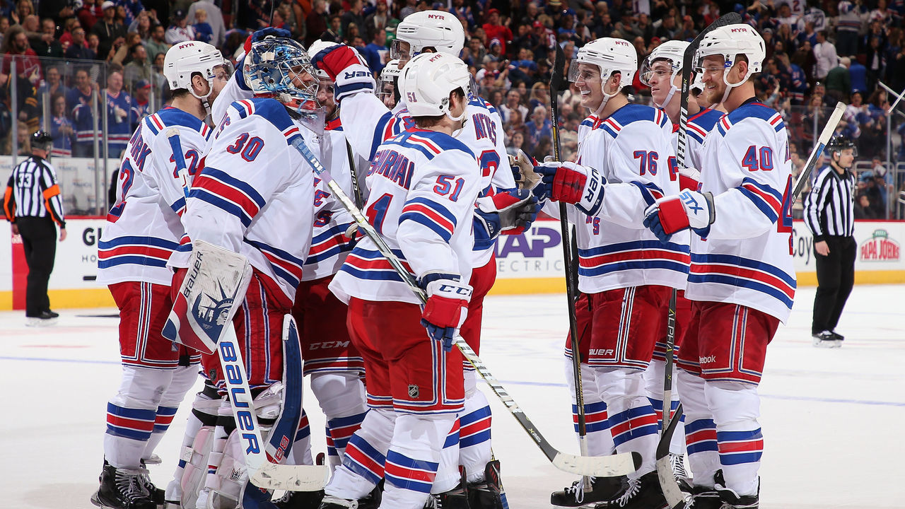 GLENDALE, AZ - JANUARY 06: Goaltender Henrik Lundqvist #30 of the New York Rangers is congratulated by teammates after defeating the Arizona Coyotes in the NHL game at Gila River Arena on January 6, 2018 in Glendale, Arizona. The Rangers defeated the Coyotes 2-1 in an overtime shootout.