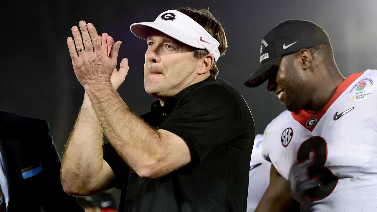 PASADENA, CA - JANUARY 01: Head Coach Kirby Smart of the Georgia Bulldogs is presented the trophy after the Bulldogs beat the Oklahoma Sooners 54-48 in double overtime in the 2018 College Football Playoff Semifinal Game at the Rose Bowl Game presented by Northwestern Mutual at the Rose Bowl on January 1, 2018 in Pasadena, California.