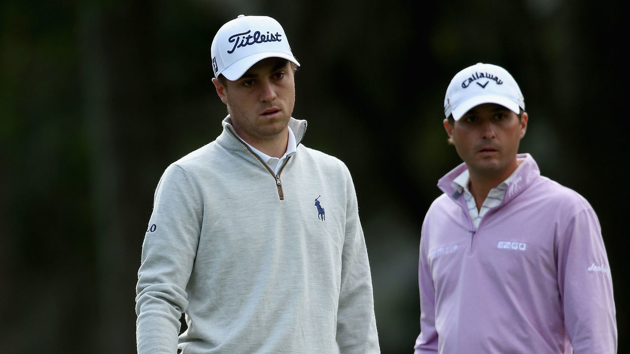 HILTON HEAD ISLAND, SC - APRIL 14: (L-R) Justin Thomas reacts to a putt on the 12th hole as Kevin Kisner watches on during the first round of the 2016 RBC Heritage at Harbour Town Golf Links on April 14, 2016 in Hilton Head Island, South Carolina.