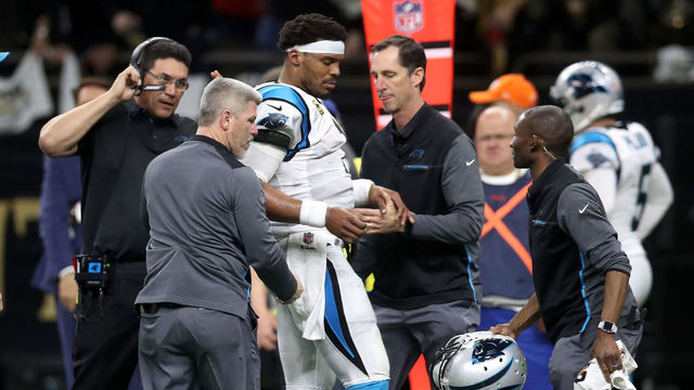 NEW ORLEANS, LA - JANUARY 07: Cam Newton #1 of the Carolina Panthers is checked on the sideline after a tackle during the game against the New Orleans Saints at the Mercedes-Benz Superdome on January 7, 2018 in New Orleans, Louisiana.