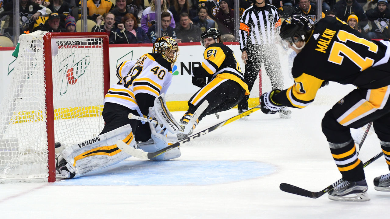 PITTSBURGH, PA - JANUARY 07: Evgeni Malkin #71 of the Pittsburgh Penguins puts the game winning goal in overtime past Tukka Rask of the Boston Bruins at PPG PAINTS Arena on January 7, 2018 in Pittsburgh, Pennsylvania.