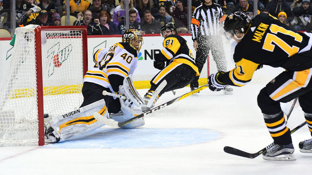 PITTSBURGH, PA - JANUARY 07: Evgeni Malkin #71 of the Pittsburgh Penguins puts the game winning goal in overtime past Tukka Rask of the Boston Bruins at PPG PAINTS Arena on January 7, 2018 in Pittsburgh, Pennsylvania.