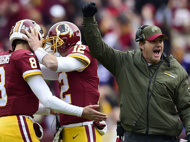 LANDOVER, MD - NOVEMBER 12: Quarterback Kirk Cousins #8 of the Washington Redskins, Colt McCoy #12 of the Washington Redskins and head coach Jay Gruden of the Washington Redskins celebrate a touchdown that was reviewed during the first quarter against the Minnesota Vikings at FedExField on November 12, 2017 in Landover, Maryland.