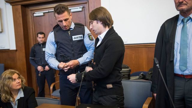 The German-Russian suspect, known as Sergei W, who is accused of having carried out a bomb attack on the Borussia Dortmund football team's bus, arrives for his trial on January 08, 2018 at the district courthouse in Dortmund, western Germany. The suspect was arrested 10 days after he allegedly set off three explosive devices hidden in a hedge as the bus was leaving the team hotel for a Champions League match in an elaborate bid to make a fortune on the stock market. / AFP PHOTO / POOL / Bernd Thissen