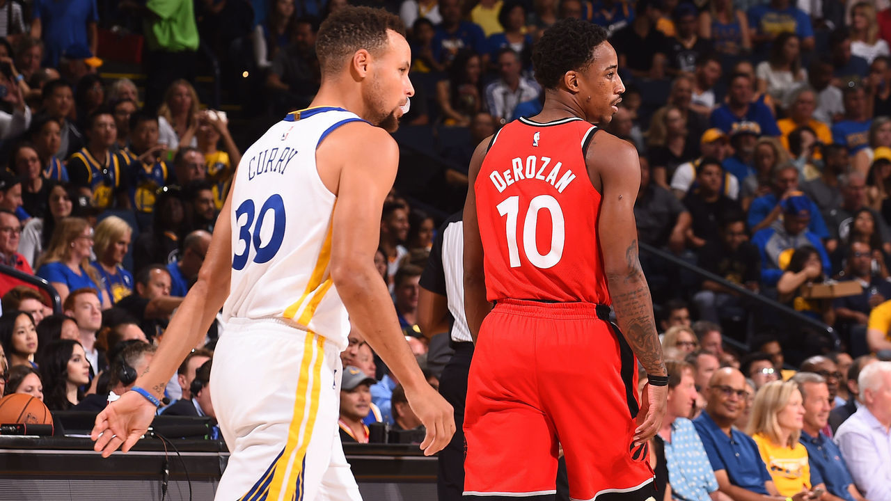 OAKLAND, CA - OCTOBER 25: Stephen Curry #30 of the Golden State Warriors and DeMar DeRozan #10 of the Toronto Raptors walk up court during the game on October 25, 2017 at ORACLE Arena in Oakland, California. NOTE TO USER: User expressly acknowledges and agrees that, by downloading and or using this photograph, user is consenting to the terms and conditions of Getty Images License Agreement. Mandatory Copyright Notice: Copyright 2017 NBAE