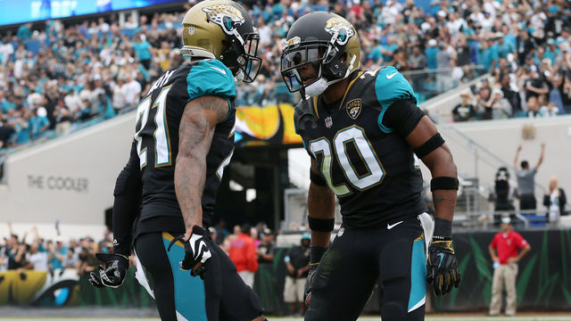 JACKSONVILLE, FL - DECEMBER 03: Jalen Ramsey #20 and A.J. Bouye #21 of the Jacksonville Jaguars celebrate after Ramsey had an interception in the first half of their game against the Indianapolis Colts at EverBank Field on December 3, 2017 in Jacksonville, Florida.