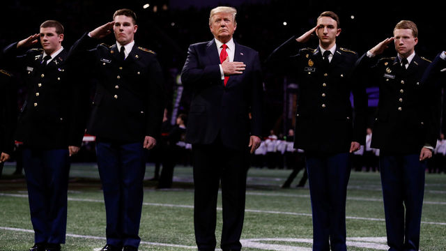 ATLANTA, GA - JANUARY 08: U.S. President Donald Trump on field during the national anthem prior to the CFP National Championship presented by AT&T between the Georgia Bulldogs and the Alabama Crimson Tide at Mercedes-Benz Stadium on January 8, 2018 in Atlanta, Georgia.