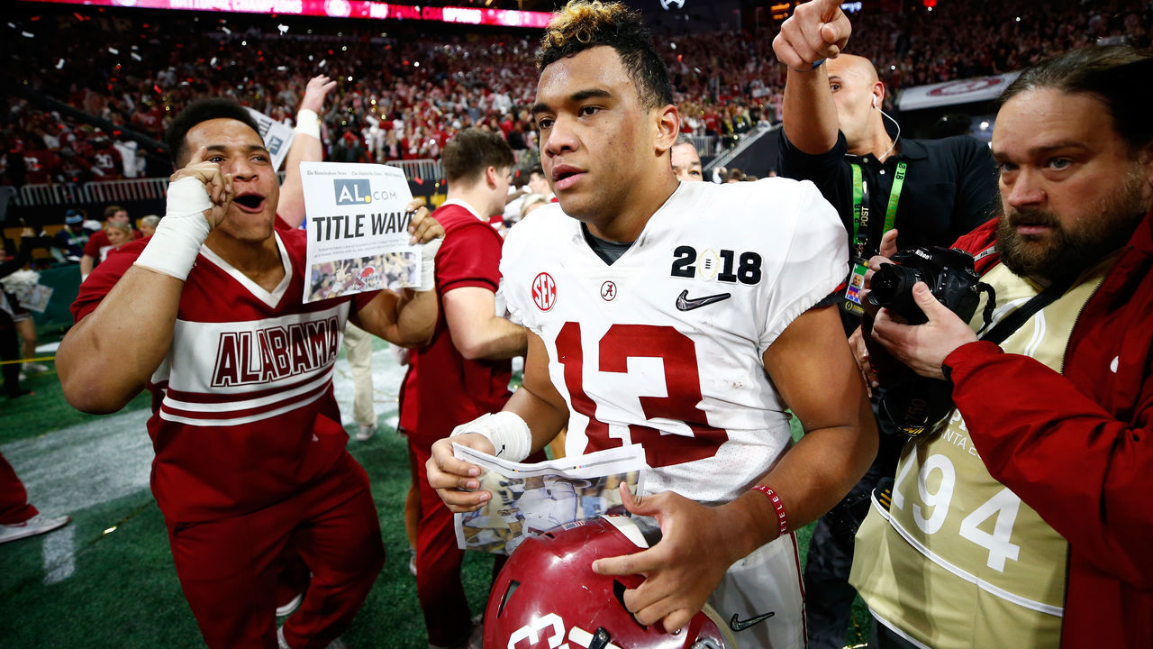 ATLANTA, GA - JANUARY 08: Tua Tagovailoa #13 of the Alabama Crimson Tide celebrates beating the Georgia Bulldogs in overtime to win the CFP National Championship presented by AT&T at Mercedes-Benz Stadium on January 8, 2018 in Atlanta, Georgia.