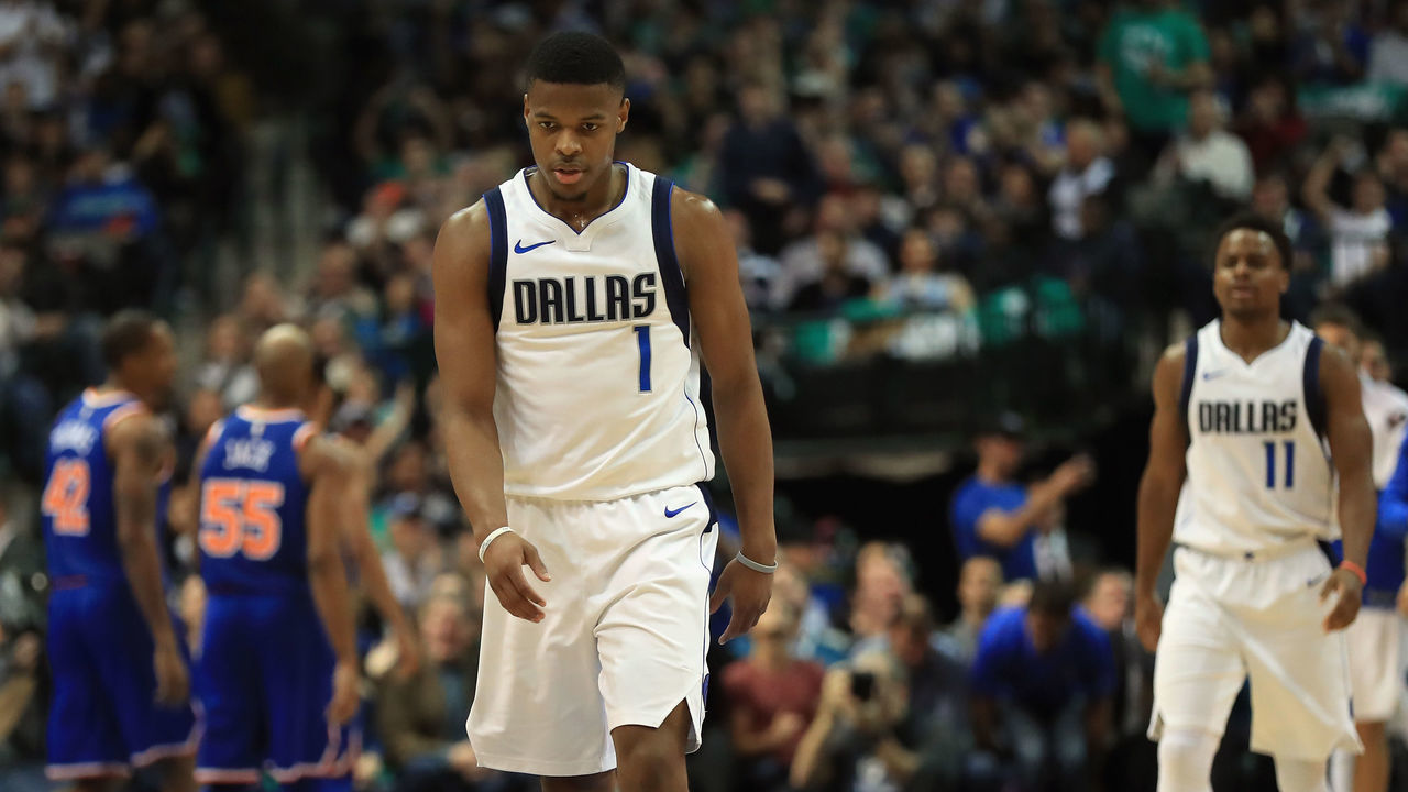 DALLAS, TX - JANUARY 07: Dennis Smith Jr. #1 of the Dallas Mavericks walks off the court at American Airlines Center on January 7, 2018 in Dallas, Texas.