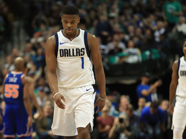 DALLAS, TX - JANUARY 07: Dennis Smith Jr. #1 of the Dallas Mavericks walks off the court at American Airlines Center on January 7, 2018 in Dallas, Texas.