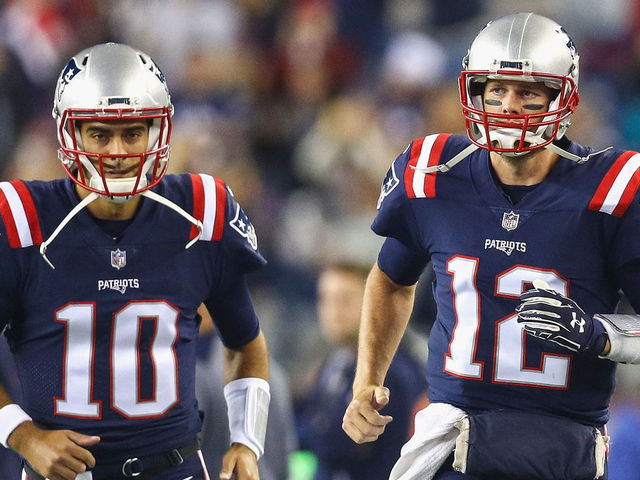FOXBORO, MA - OCTOBER 22: Tom Brady #12 and Jimmy Garoppolo #10 of the New England Patriots run onto the field before a game against the Atlanta Falcons at Gillette Stadium on October 22, 2017 in Foxboro, Massachusetts.