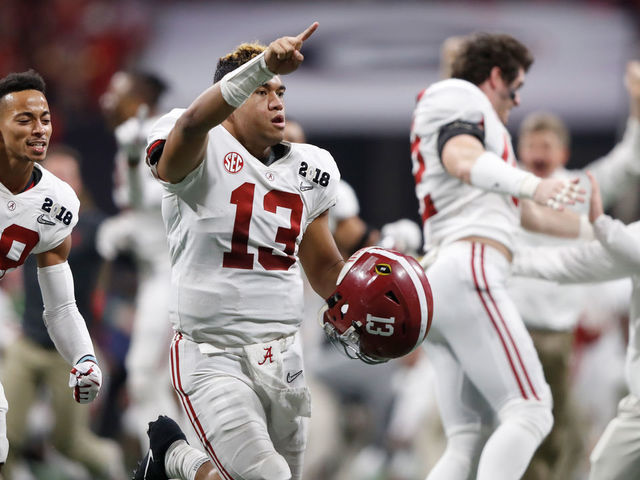 ATLANTA, GA - JANUARY 08: Tua Tagovailoa #13 of the Alabama Crimson Tide celebrates beating the Georgia Bulldogs in overtime to win the CFP National Championship presented by AT&T at Mercedes-Benz Stadium on January 8, 2018 in Atlanta, Georgia.
