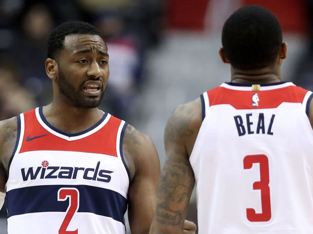 WASHINGTON, DC - DECEMBER 13: John Wall #2 and Bradley Beal #3 of the Washington Wizards talk during the second half against the Memphis Grizzlies at Capital One Arena on December 13, 2017 in Washington, DC.