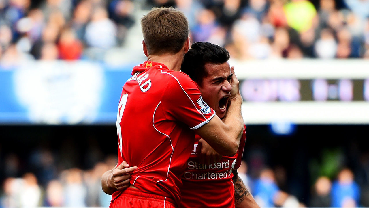 LONDON, ENGLAND - OCTOBER 19: Philippe Coutinho of Liverpool celebrates with team-mate Steven Gerrard after scoring his team's second goal during the Barclays Premier League match between Queens Park Rangers and Liverpool at Loftus Road on October 19, 2014 in London, England.