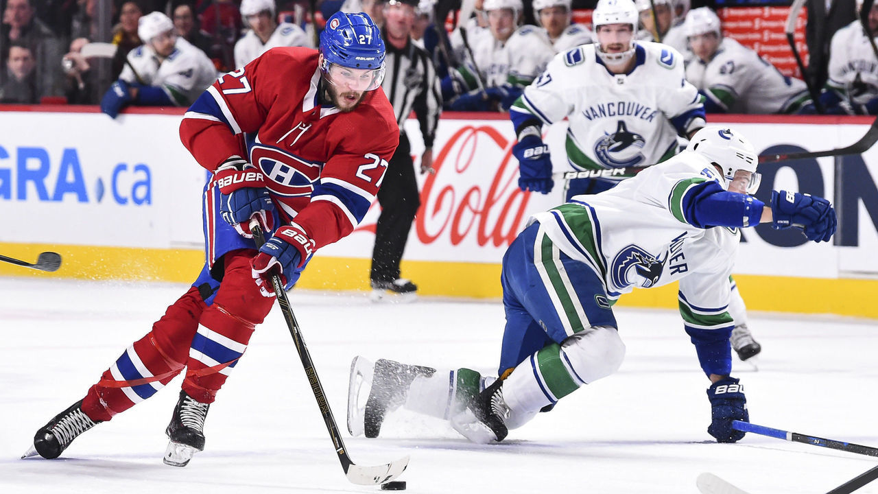 MONTREAL, QC - JANUARY 07: Alex Galchenyuk #27 of the Montreal Canadiens skates the puck against the Vancouver Canucks during the NHL game at the Bell Centre on January 7, 2018 in Montreal, Quebec, Canada.