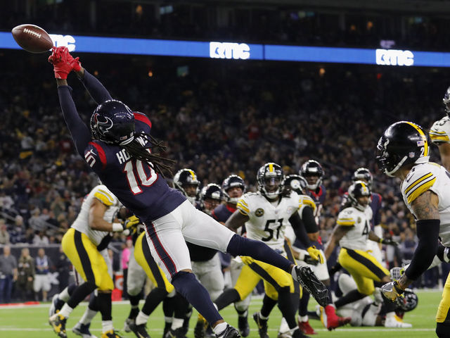 HOUSTON, TX - DECEMBER 25: DeAndre Hopkins #10 of the Houston Texans reaches for a pass on a two point conversion attempt defended by Joe Haden #21 of the Pittsburgh Steelers in the fourth quarter at NRG Stadium on December 25, 2017 in Houston, Texas.