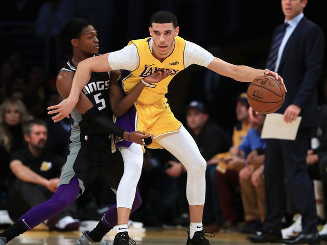 LOS ANGELES, CA - JANUARY 09: De'Aaron Fox #5 of the Sacramento Kings defends against the dribble of Lonzo Ball #2 of the Los Angeles Lakers during the first half of a game at Staples Center on January 9, 2018 in Los Angeles, California.