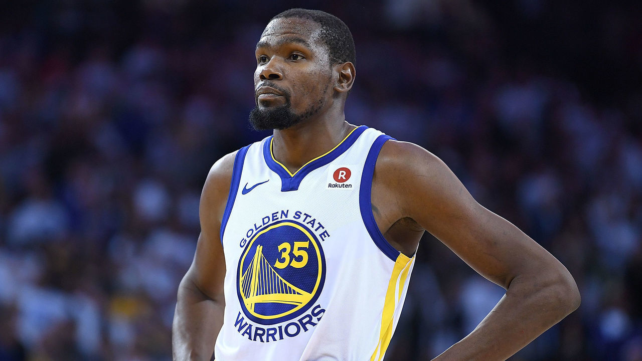 OAKLAND, CA - DECEMBER 25: Kevin Durant #35 of the Golden State Warriors looks on while there's a break in the action against the Cleveland Cavaliers late in the fouth quarter of an NBA basketball game at ORACLE Arena on December 25, 2017 in Oakland, California.