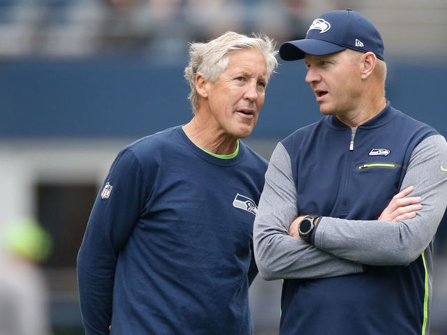 SEATTLE, WA - SEPTEMBER 17: Head coach Pete Carroll of the Seattle Seahawks, left, talks with offensive coordinator Darrell Bevell before the game against the San Francisco 49ers at CenturyLink Field on September 17, 2017 in Seattle, Washington.