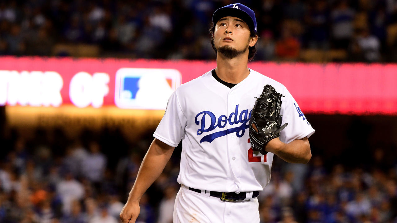 LOS ANGELES, CA - NOVEMBER 01: Yu Darvish #21 of the Los Angeles Dodgers walks to the dugout after being relieved during the second inning against the Houston Astros in game seven of the 2017 World Series at Dodger Stadium on November 1, 2017 in Los Angeles, California.